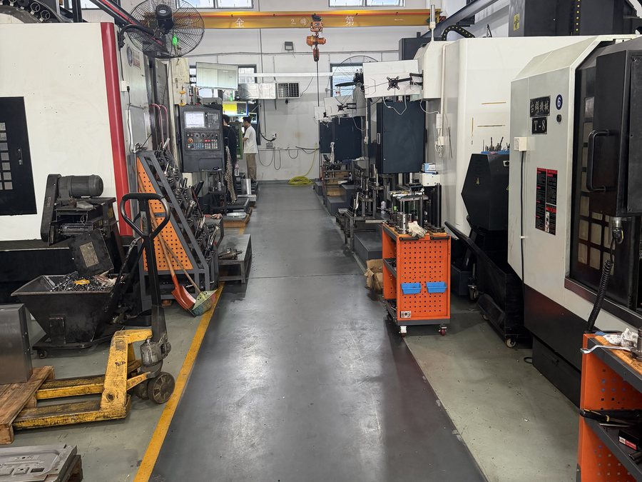 Machining bay in Factory Area 3 with CNC centres on both sides and the overhead crane