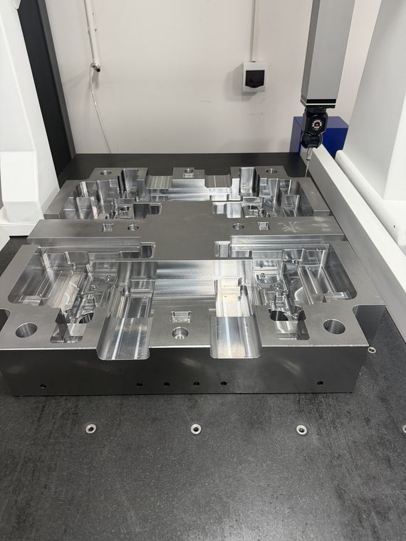 Multi-cavity mold core being machined inside a CNC machine